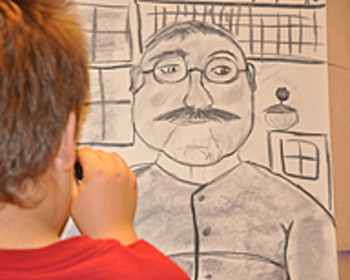 Pojke tecknar under bildlektion på Tyresö kulturskola.
